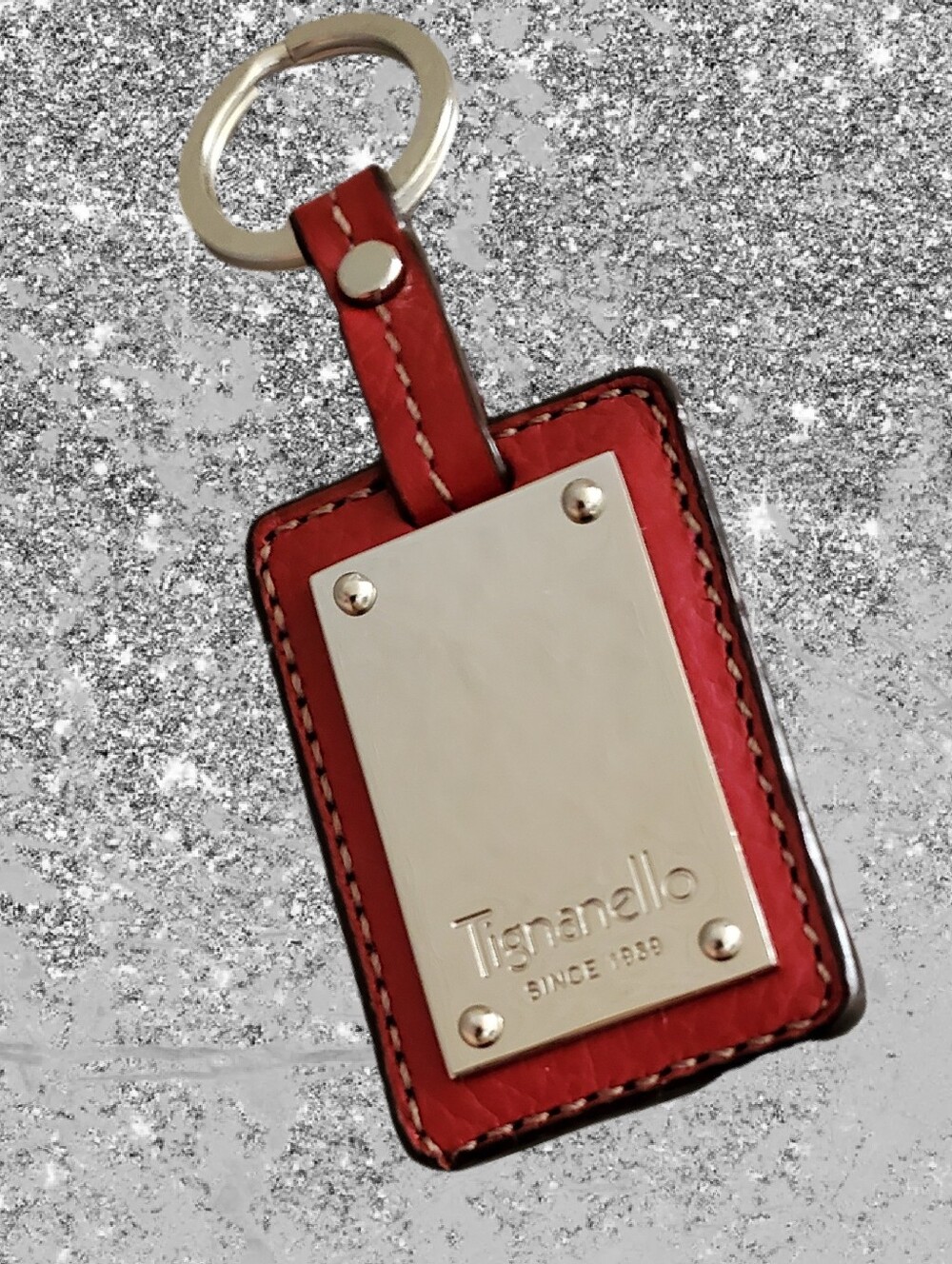 NEVER USED Tignanello red leather key with metal plate